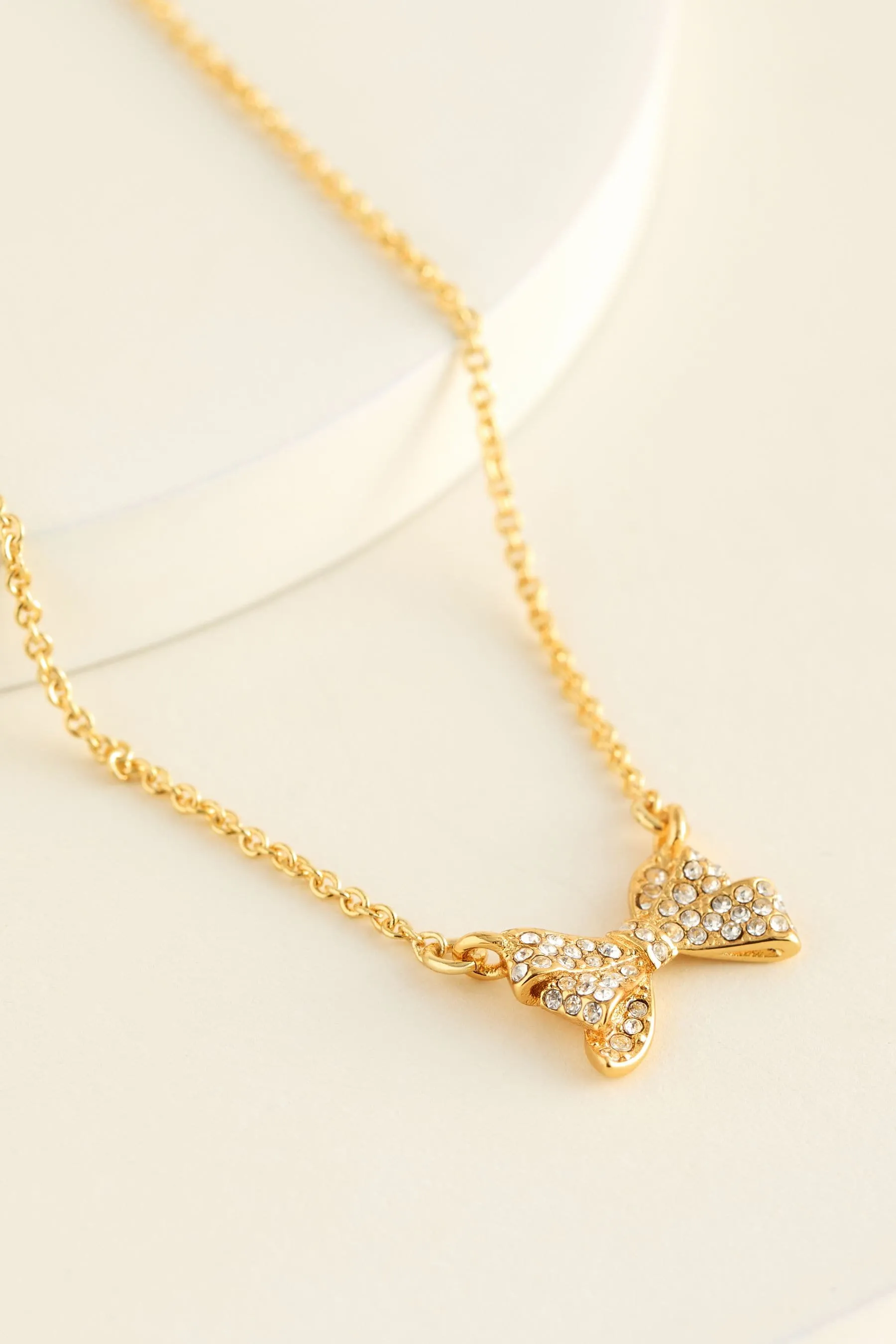 Barsie Crystal Bow Pendant Necklace Gold