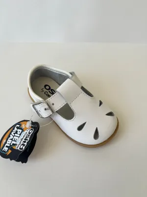 White tstrap with front detail shoe